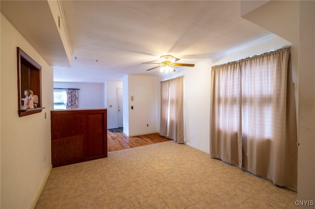 unfurnished room featuring ceiling fan and light hardwood / wood-style floors