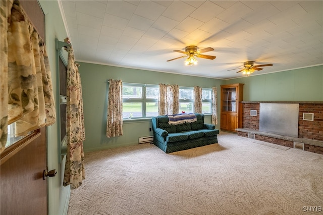 carpeted living room with a fireplace, ornamental molding, ceiling fan, and a baseboard radiator