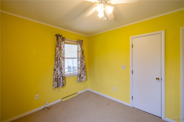 spare room with crown molding, a baseboard heating unit, ceiling fan, and light carpet