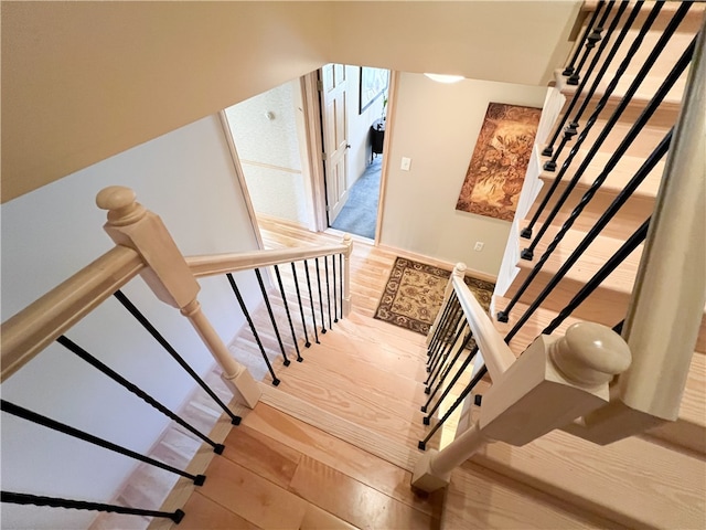 stairway featuring hardwood / wood-style floors