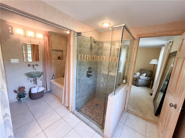 bathroom with separate shower and tub and tile patterned floors