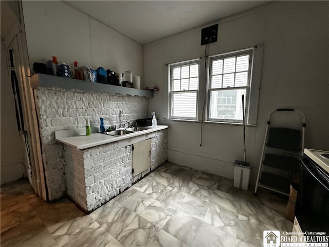 kitchen with white range with electric stovetop and sink