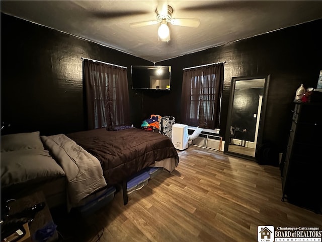 bedroom featuring ceiling fan and hardwood / wood-style flooring