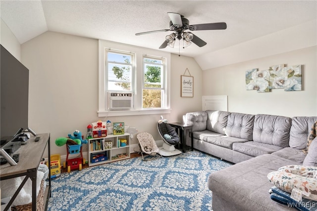 living room with ceiling fan, cooling unit, carpet flooring, a textured ceiling, and vaulted ceiling