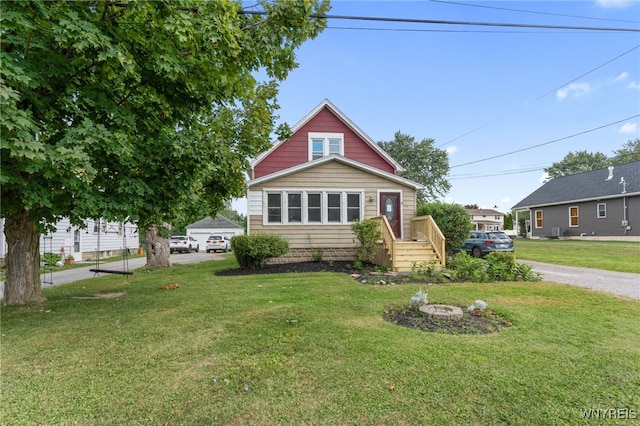 view of front of home featuring a front lawn