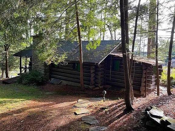 8578 County Road 49, Rushford, NY 14717 - view of home's exterior featuring log exterior and roof with shingles