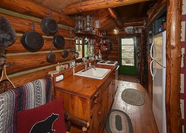 8578 County Road 49, Rushford, NY 14717 - bathroom featuring rustic walls, beam ceiling, hardwood / wood-style floors, wooden ceiling, and vanity