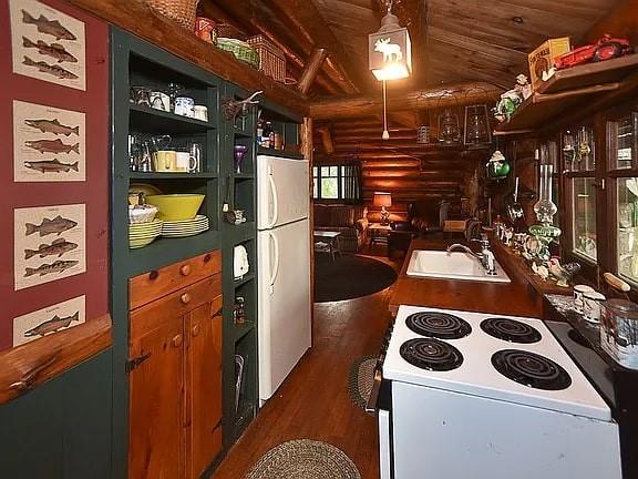 8578 County Road 49, Rushford, NY 14717 - kitchen with white appliances, dark wood finished floors, wooden ceiling, vaulted ceiling, and a sink