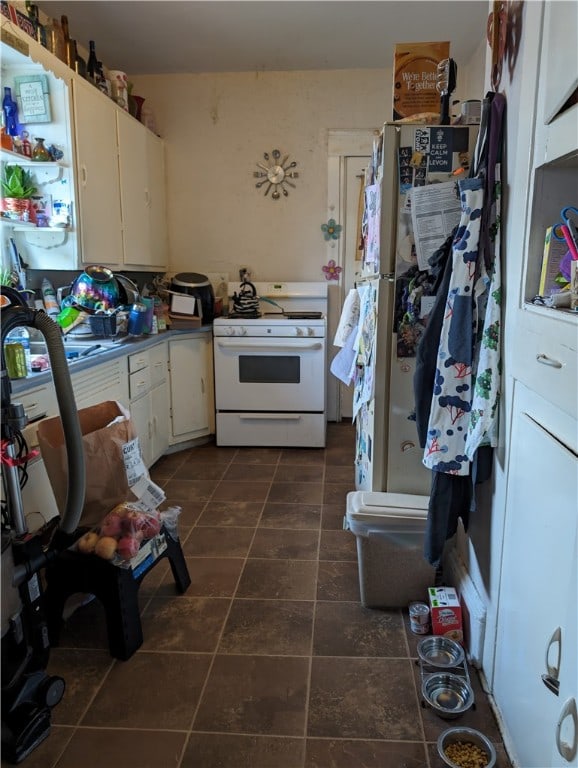 kitchen with white cabinets and white appliances