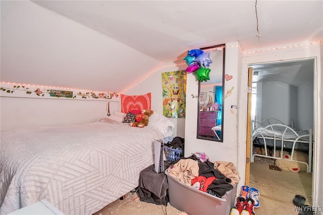 bedroom featuring lofted ceiling