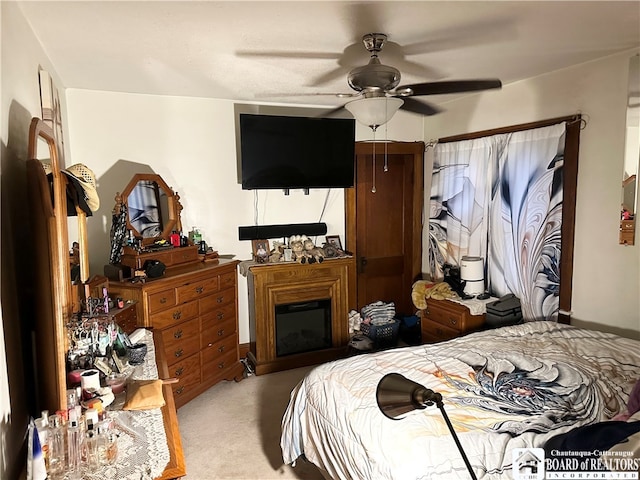 carpeted bedroom featuring ceiling fan