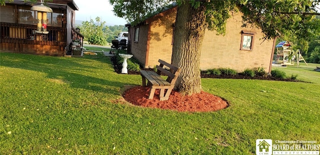 view of home's exterior with a yard