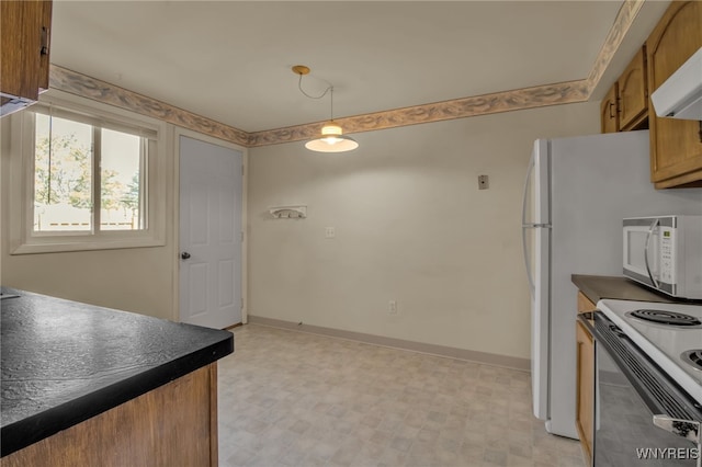 kitchen featuring hanging light fixtures, range hood, and stainless steel range with electric cooktop