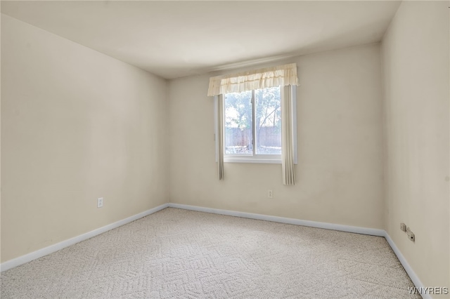 unfurnished room featuring carpet