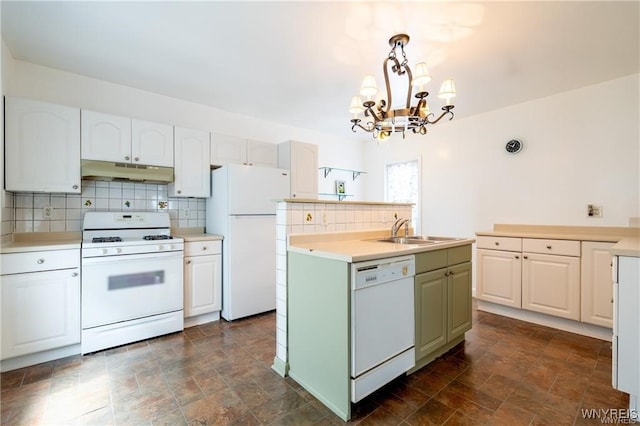 kitchen with sink, white cabinets, white appliances, and decorative light fixtures