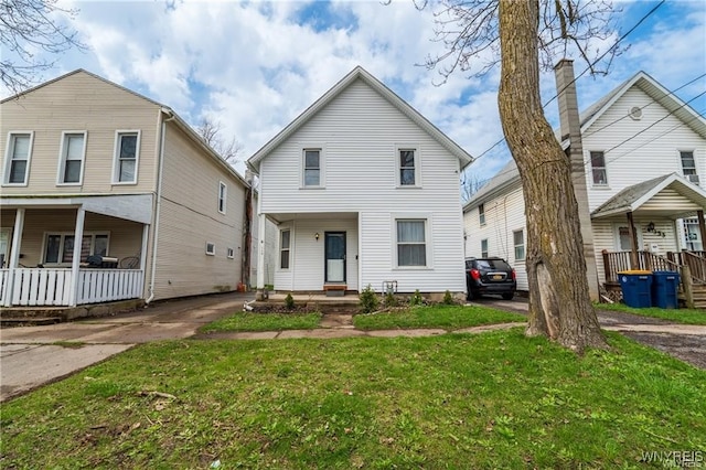 front of property with a porch and a front lawn