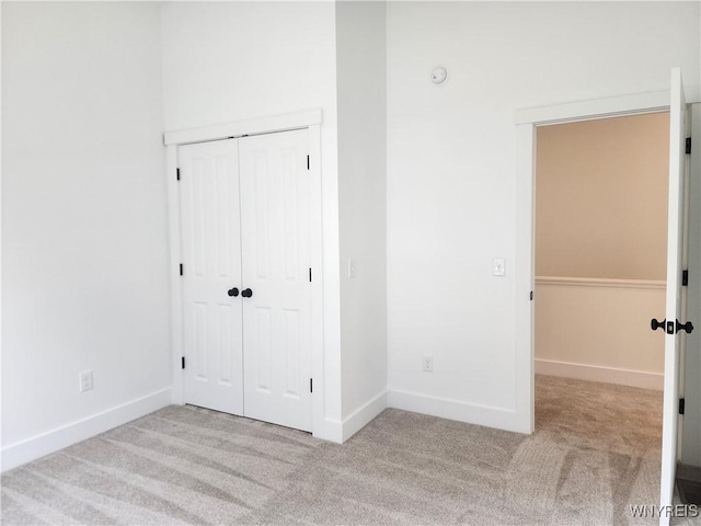 28 Glen Burn Trl, Ellicottville, NY 14731 - unfurnished bedroom with light carpet, a closet, and baseboards