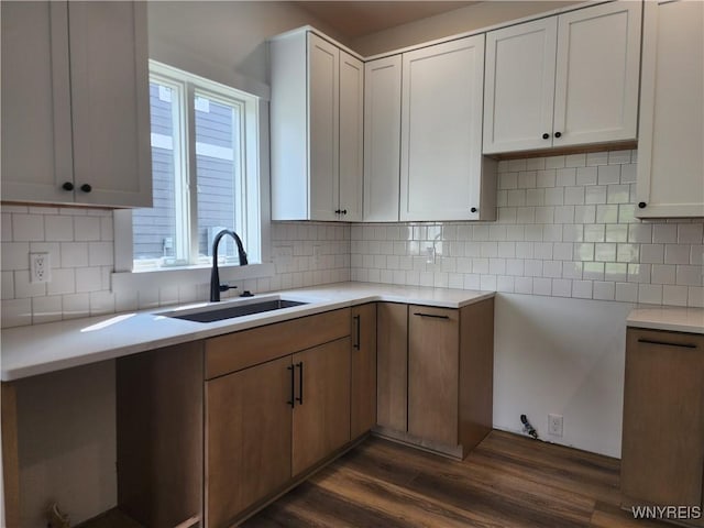 28 Glen Burn Trl, Ellicottville, NY 14731 - kitchen featuring a sink, dark wood-style floors, backsplash, and light countertops