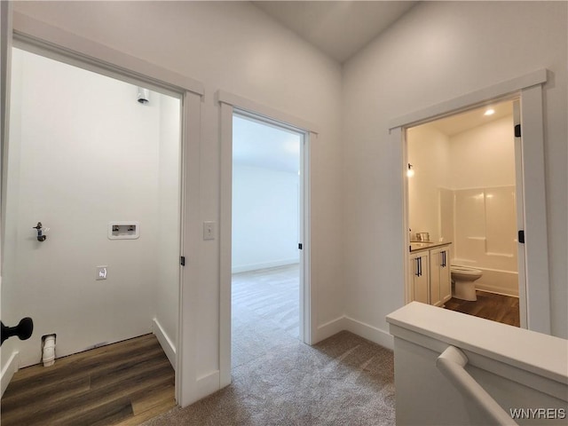 28 Glen Burn Trl, Ellicottville, NY 14731 - corridor featuring dark carpet, a sink, and baseboards