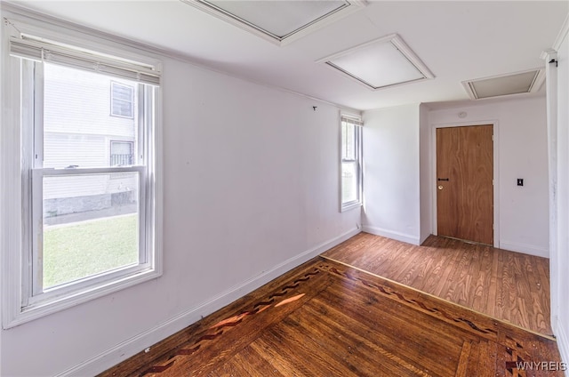 spare room with hardwood / wood-style floors