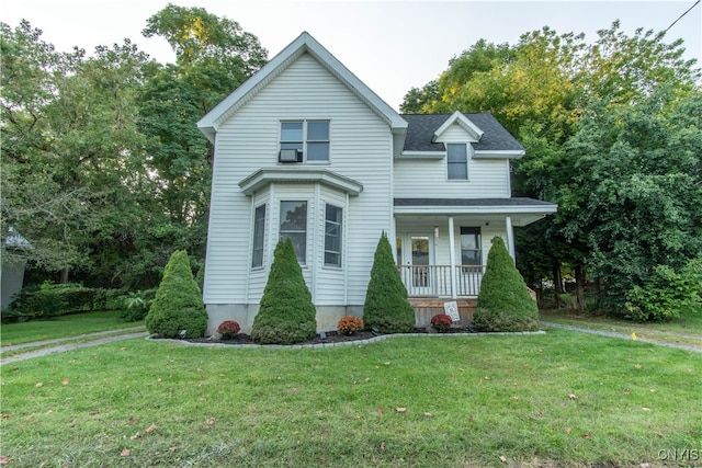 view of front of home featuring a front yard and a porch