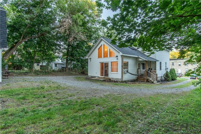 view of property exterior featuring a lawn