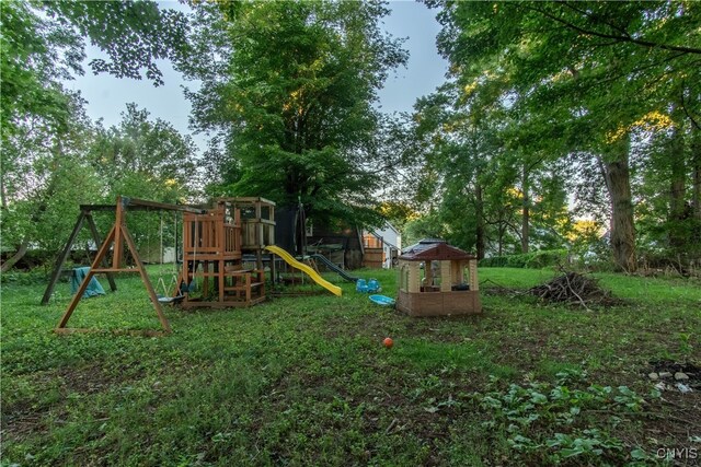 view of jungle gym with a lawn