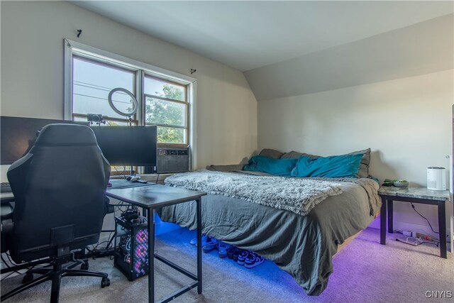 carpeted bedroom with vaulted ceiling