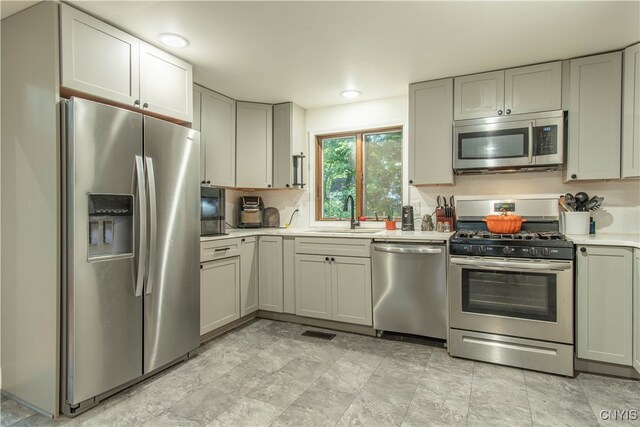 kitchen featuring stainless steel appliances and sink