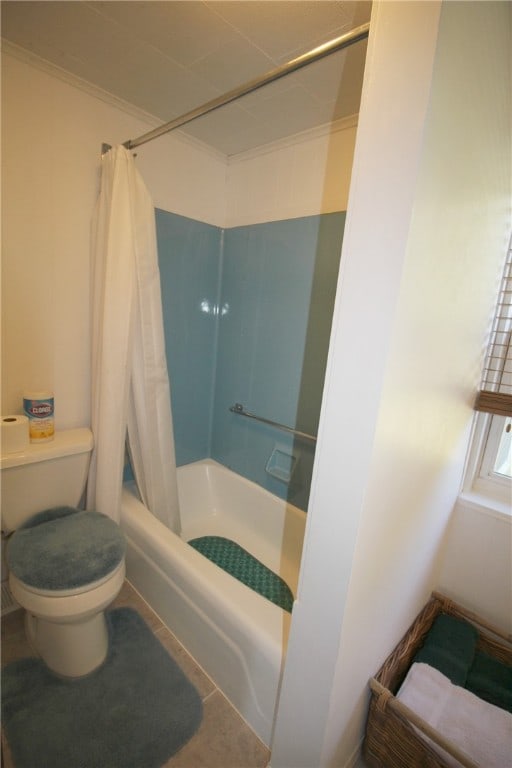 bathroom with shower / tub combo, toilet, and tile patterned floors