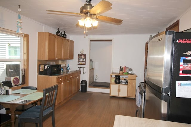 kitchen with light wood-type flooring, ceiling fan, crown molding, and stainless steel refrigerator