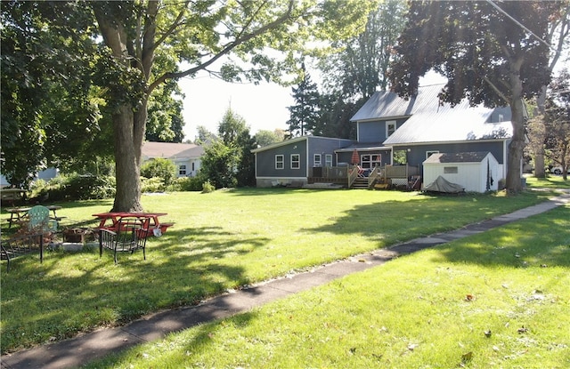 view of yard with a shed and a deck