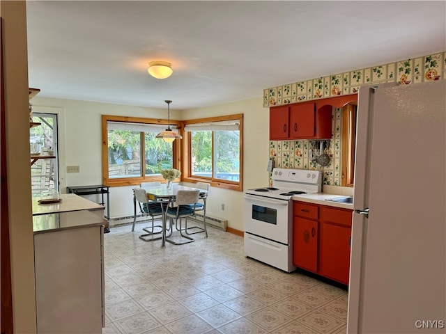 kitchen featuring pendant lighting, a baseboard heating unit, white appliances, and tasteful backsplash