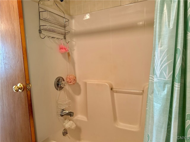 bathroom featuring shower / bath combination with curtain