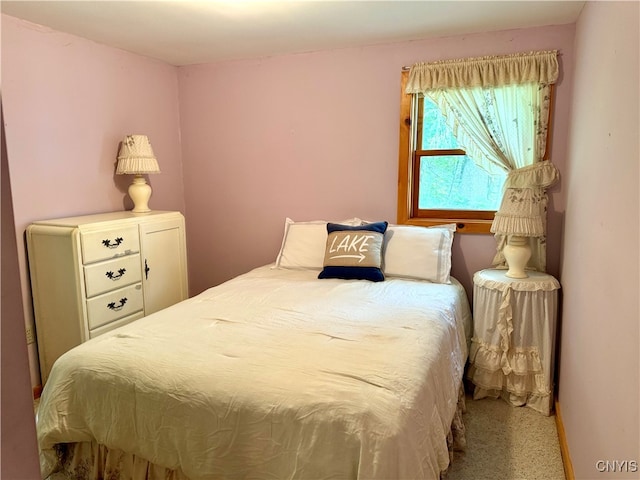 bedroom with light carpet