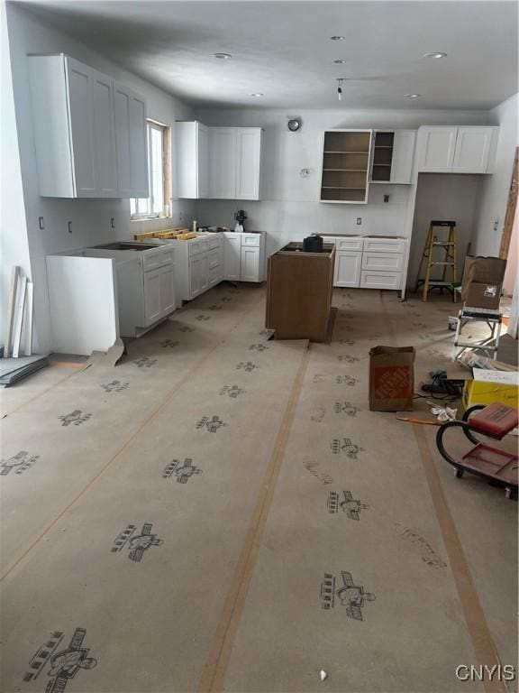 kitchen featuring white cabinets