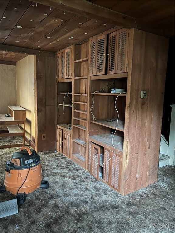 interior space with wooden ceiling and carpet floors