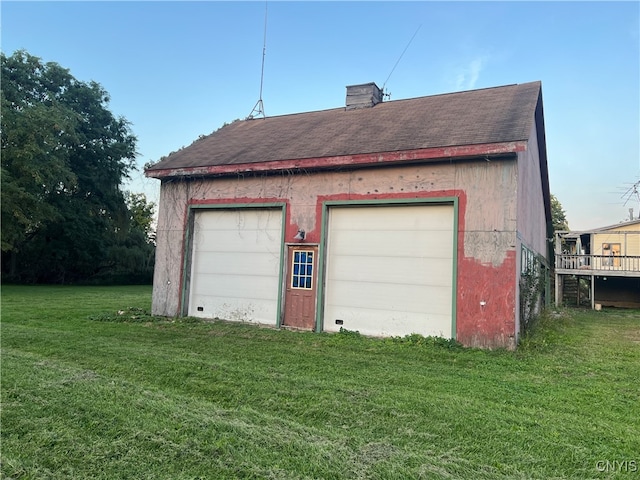 garage with a yard