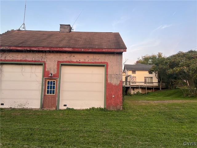 garage with a lawn