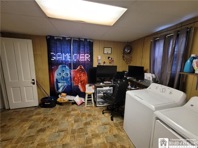 interior space with wooden walls and independent washer and dryer