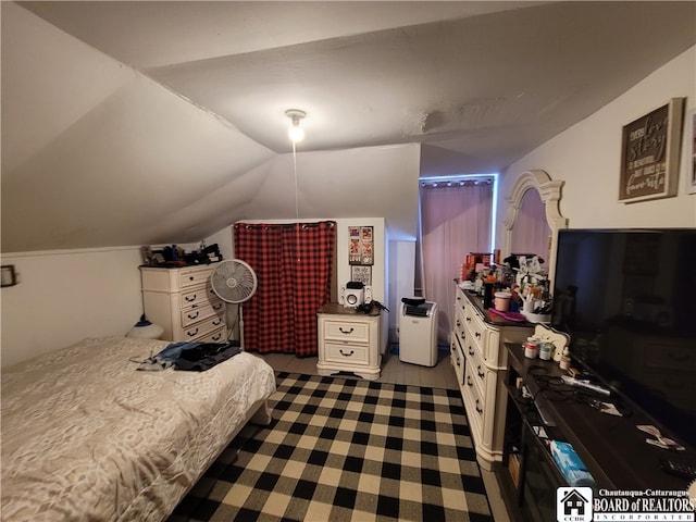 bedroom with lofted ceiling