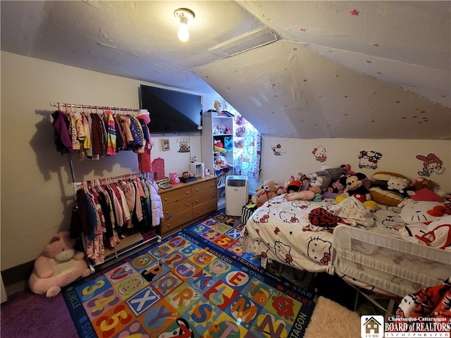 carpeted bedroom featuring lofted ceiling