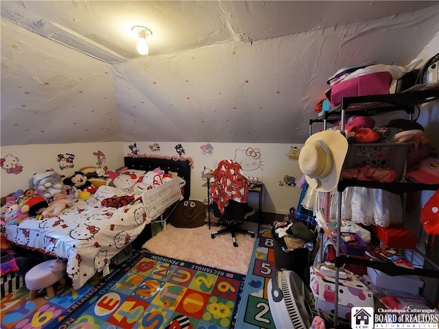 carpeted bedroom with vaulted ceiling