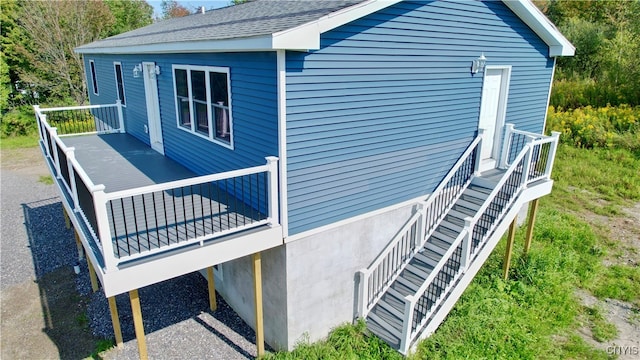 view of side of property with a wooden deck