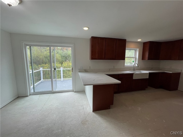 kitchen featuring kitchen peninsula and sink