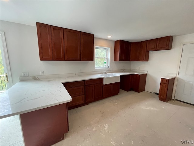 kitchen featuring kitchen peninsula and sink