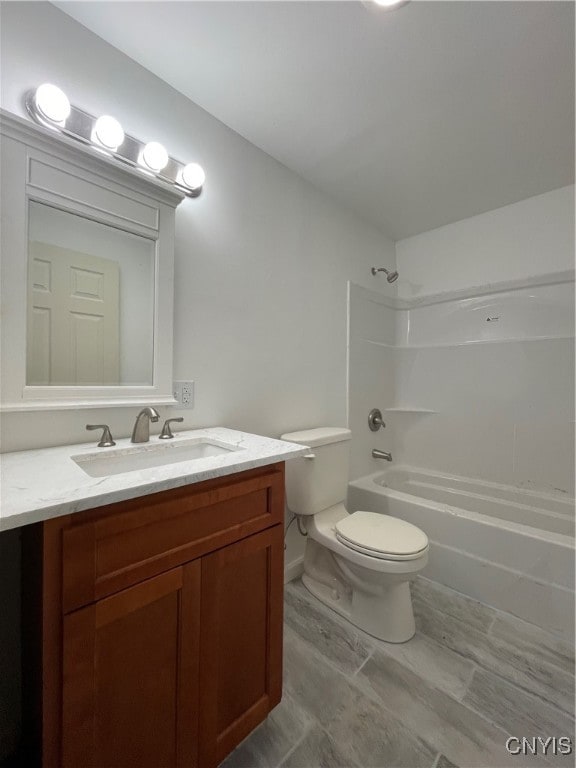 full bathroom with vanity, toilet, and bathtub / shower combination