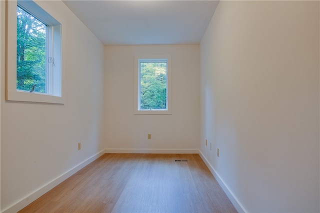 unfurnished room with light hardwood / wood-style flooring