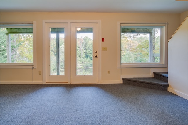 doorway featuring carpet flooring