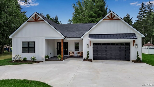 modern inspired farmhouse featuring a garage